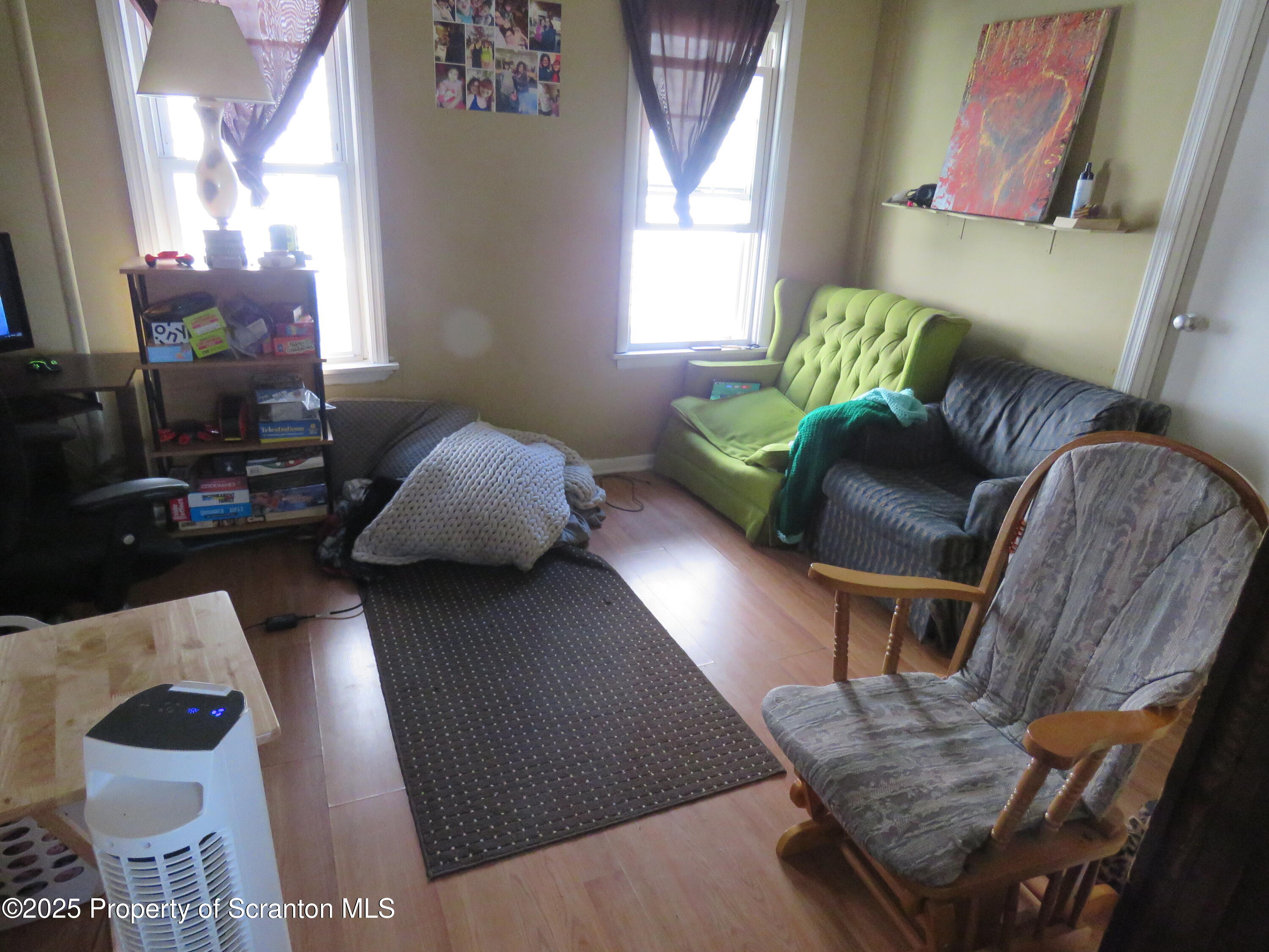 16 Hospital Street Carbondale, PA 18407 - Photo 5 of 16 a living room with furniture and a lamp