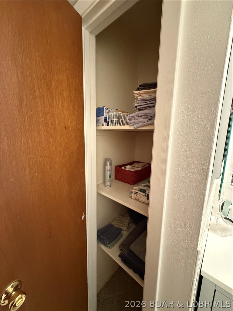 1118 Passover Road, Unit E216 Osage Beach, MO 65065 - Photo 19 of 31 Linen closet in bathroom