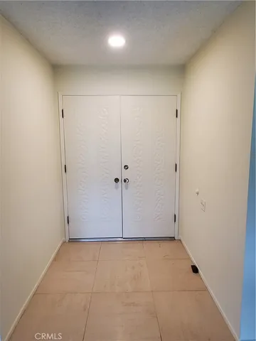 an empty room with a shower