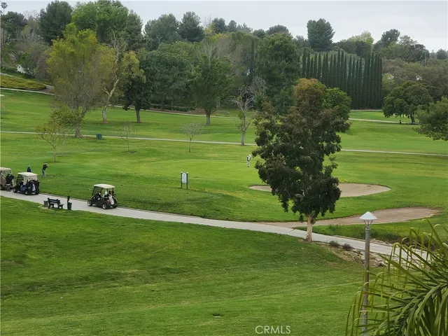 a view of a golf course with a park