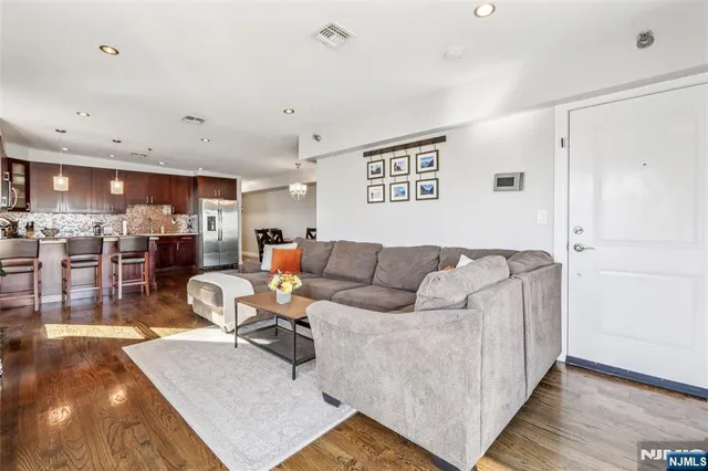 a living room with furniture and a table