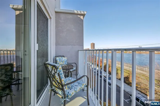 a view of a balcony with chairs