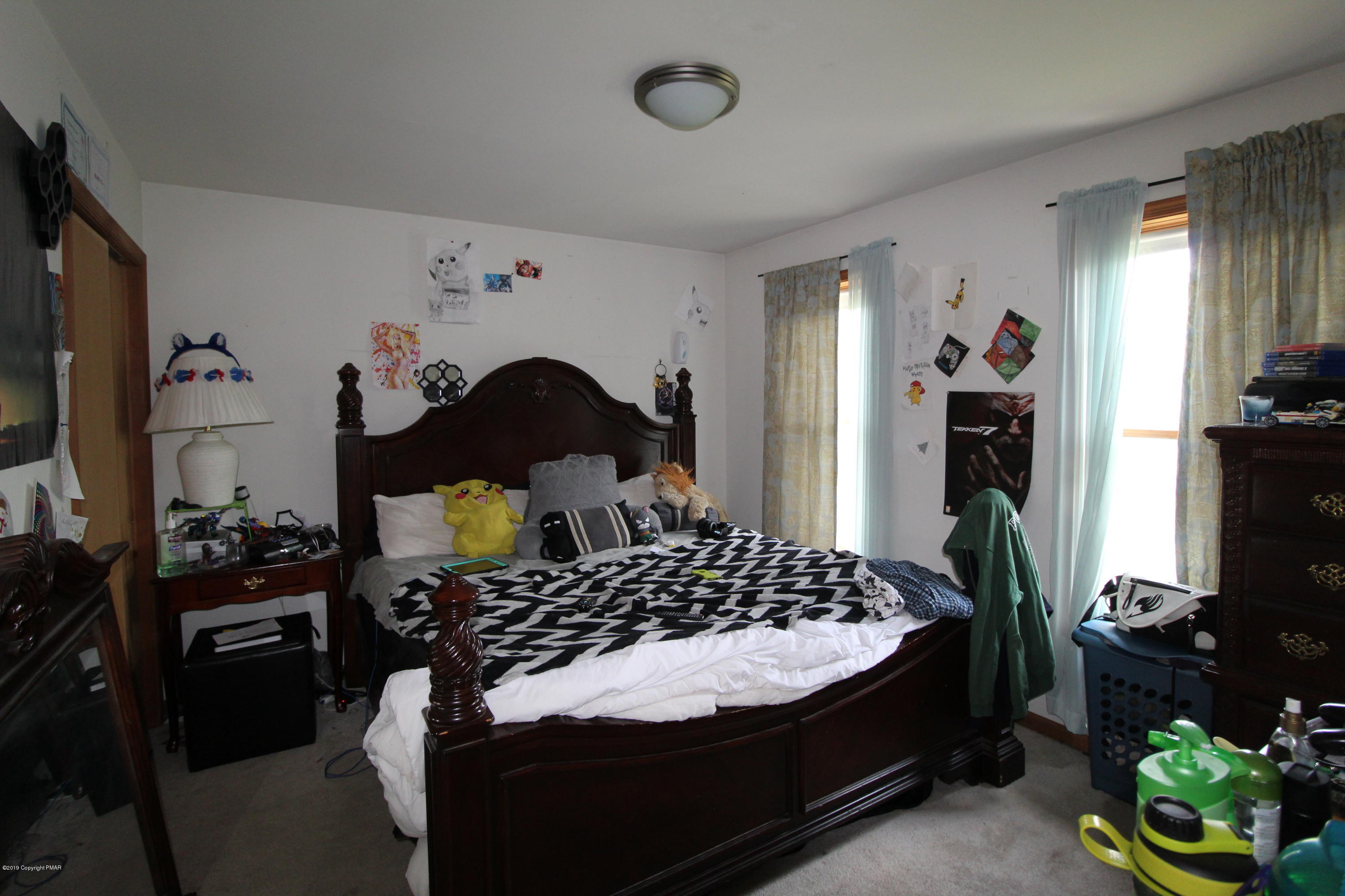 195 Granite Road Long Pond, PA 18334 - Photo 18 of 29 a bedroom with a bed and a flat tv screen on dresser