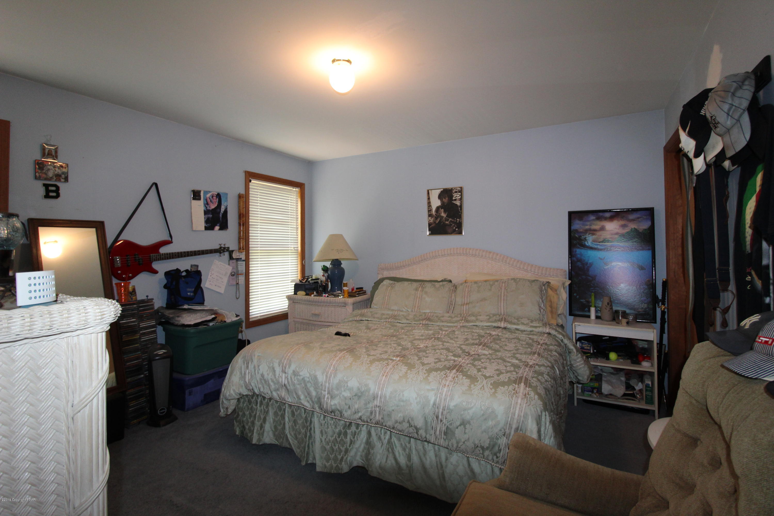 195 Granite Road Long Pond, PA 18334 - Photo 19 of 29 a bedroom with a bed a flat screen tv and dresser