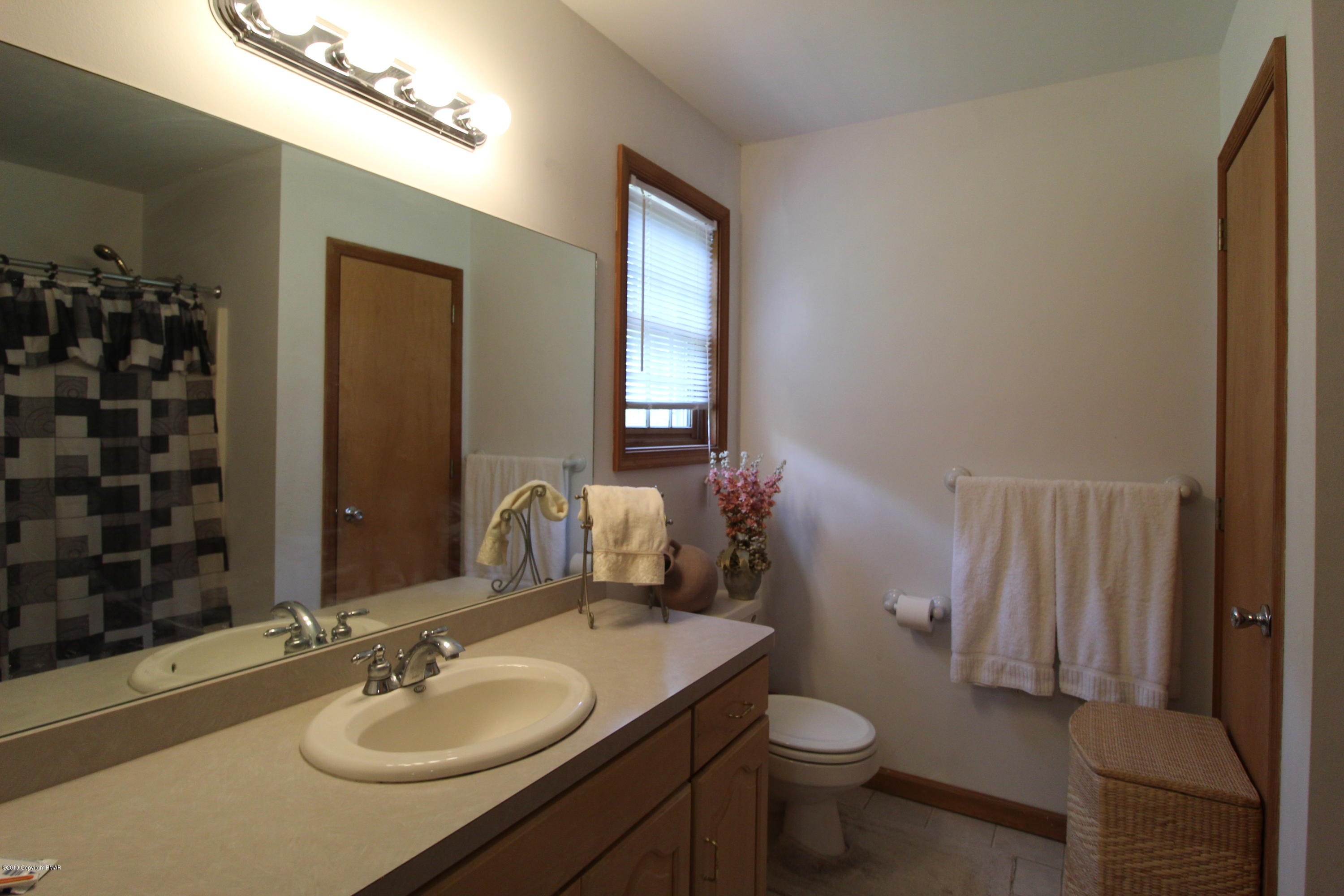 195 Granite Road Long Pond, PA 18334 - Photo 21 of 29 a bathroom with a sink toilet and shower