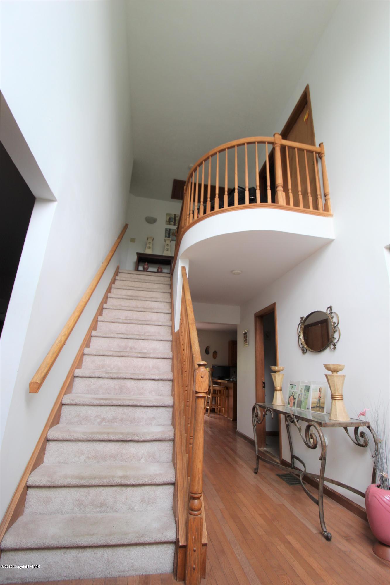 195 Granite Road Long Pond, PA 18334 - Photo 3 of 29 a view of entryway and hall with wooden floor