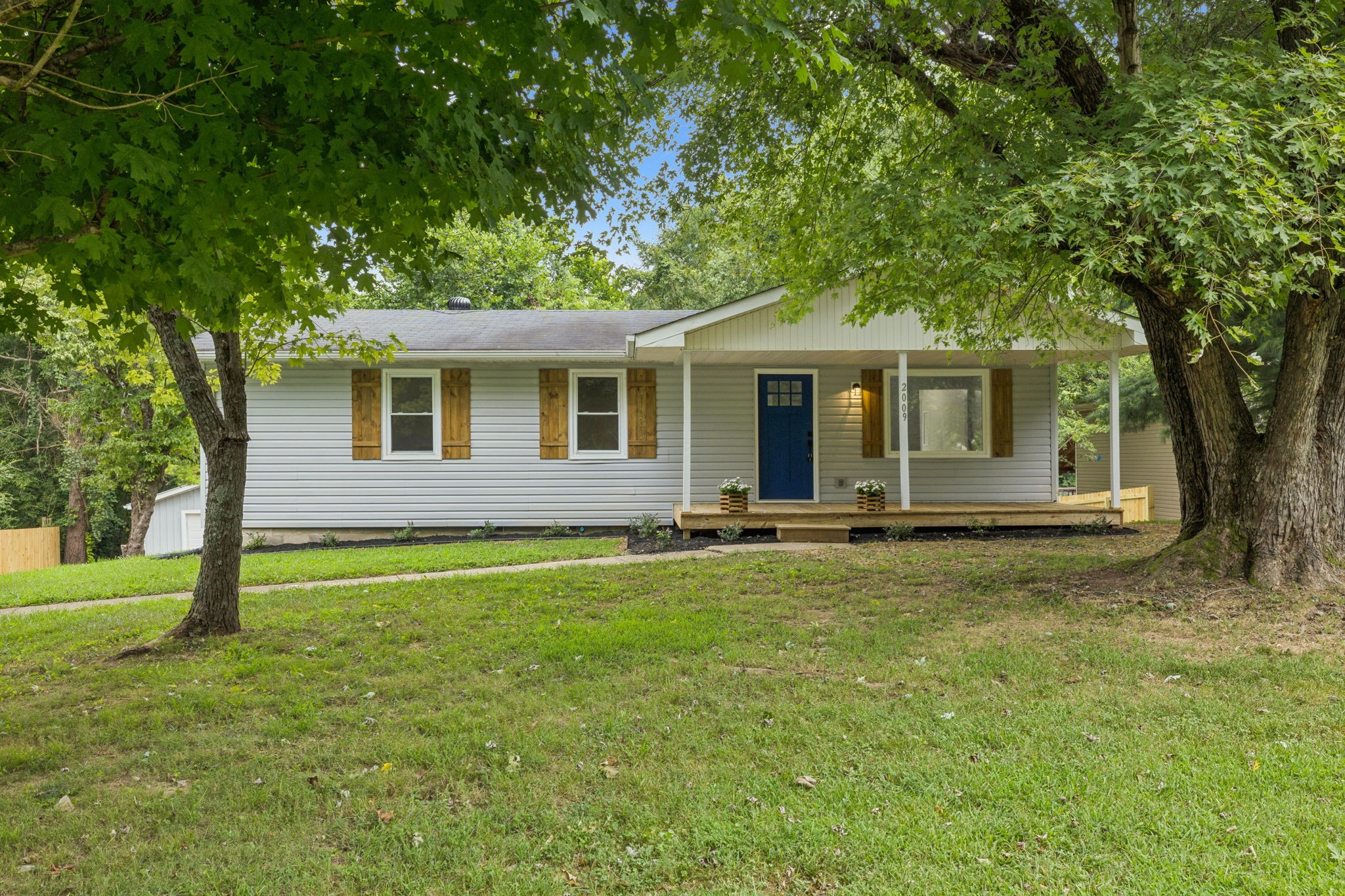 2009 7 Mile Ferry Road Clarksville, TN 37040 - Photo 1 of 31 a backyard of a house with barbeque oven table and chairs