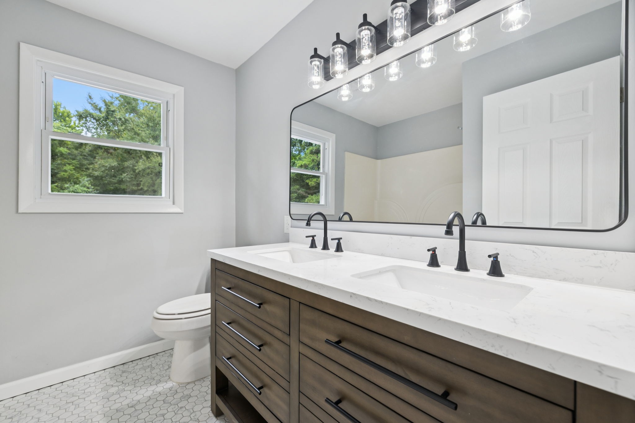 2009 7 Mile Ferry Road Clarksville, TN 37040 - Photo 11 of 31 a bathroom with a double vanity sink and a mirror