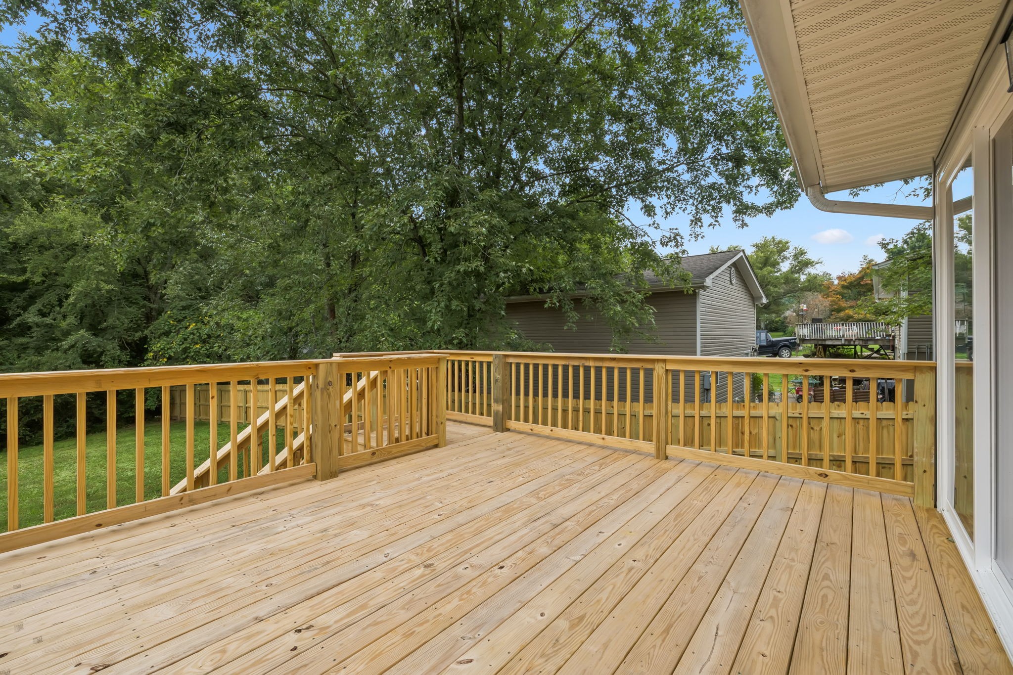 2009 7 Mile Ferry Road Clarksville, TN 37040 - Photo 23 of 31 a balcony with wooden floor and trees