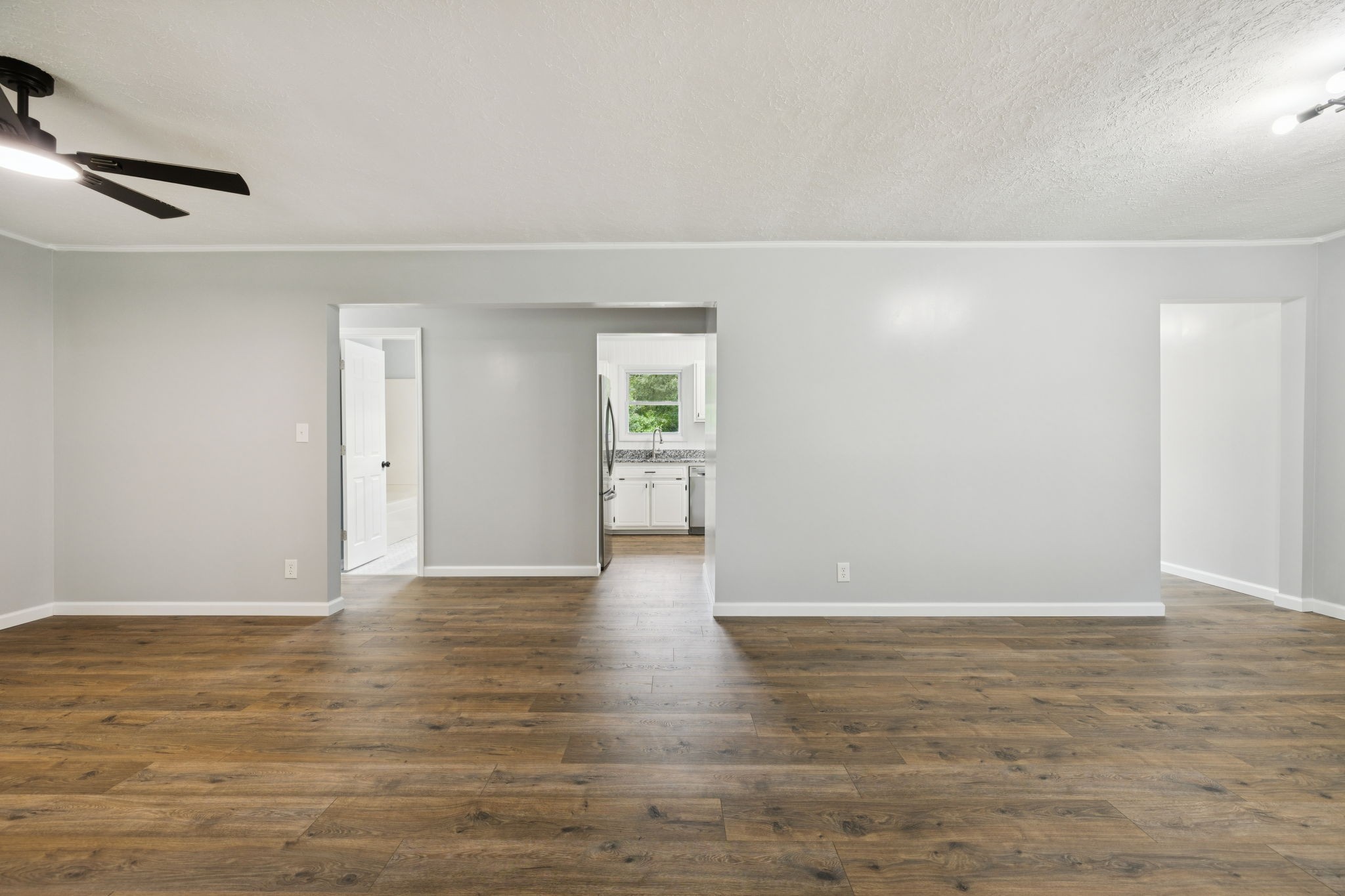 2009 7 Mile Ferry Road Clarksville, TN 37040 - Photo 3 of 31 a view of an empty room with wooden floor and a window