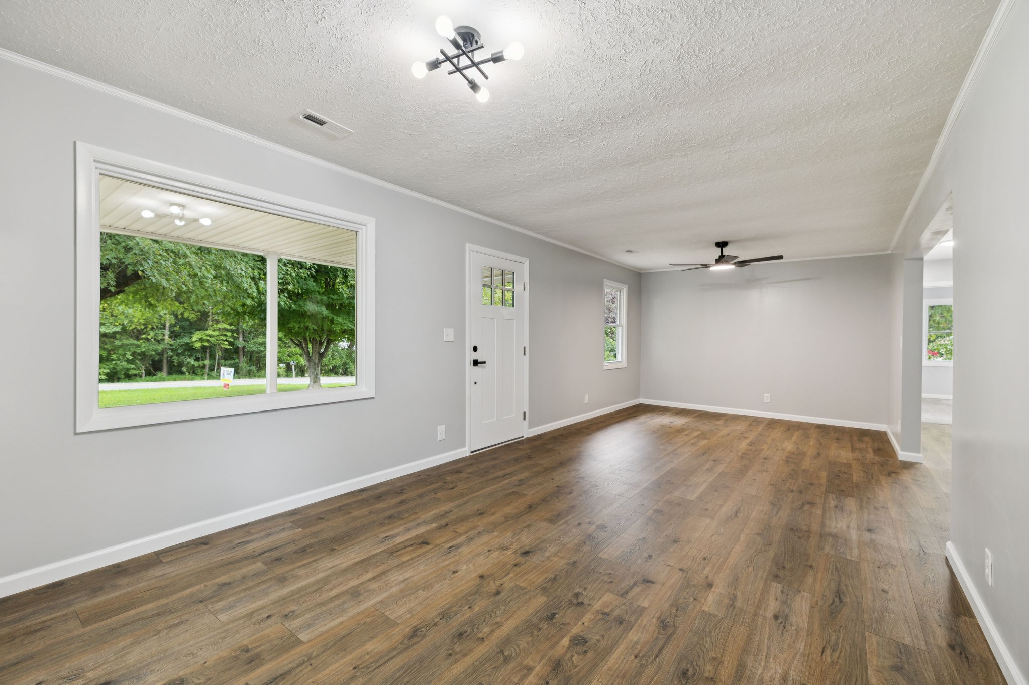 2009 7 Mile Ferry Road Clarksville, TN 37040 - Photo 5 of 31 a view of empty room with wooden floor and fan
