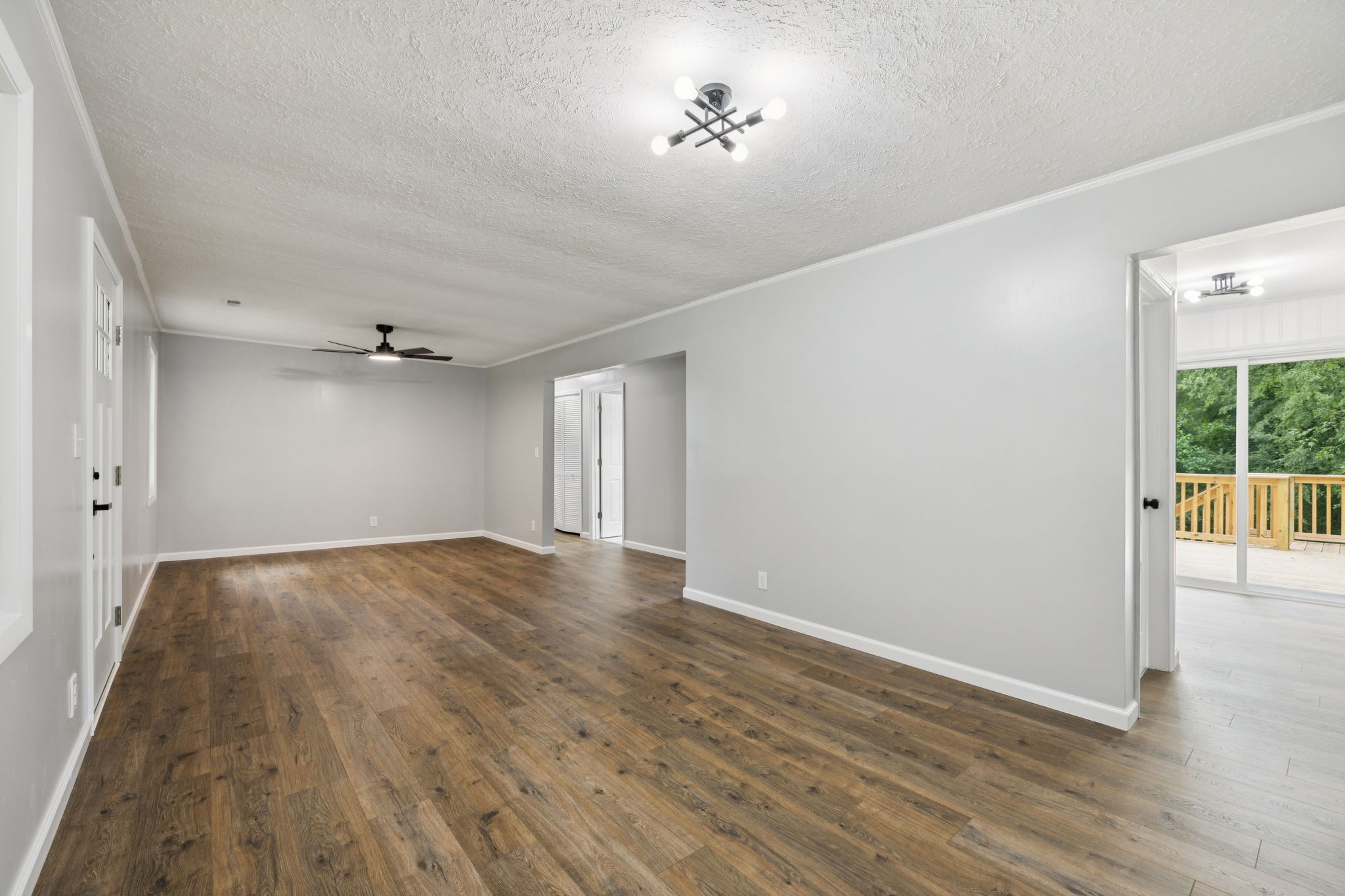 2009 7 Mile Ferry Road Clarksville, TN 37040 - Photo 6 of 31 a view of empty room with wooden floor and fan