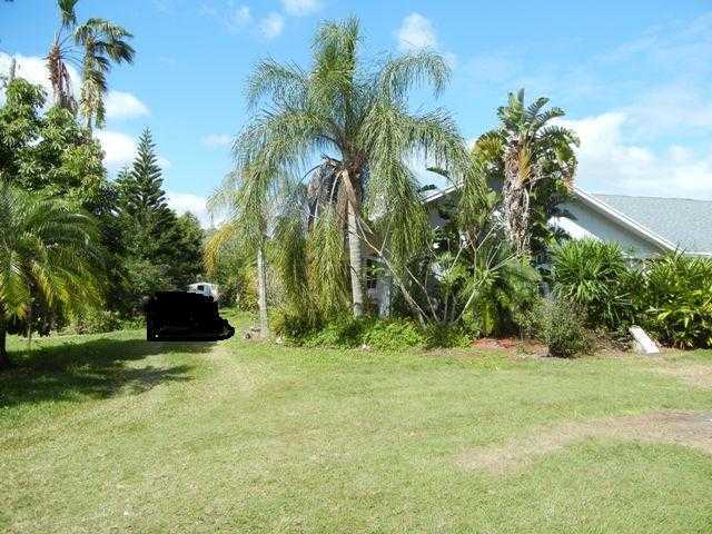 9759 Sandy Run Road Jupiter, FL 33478 - Photo 2 of 7 a view of a garden