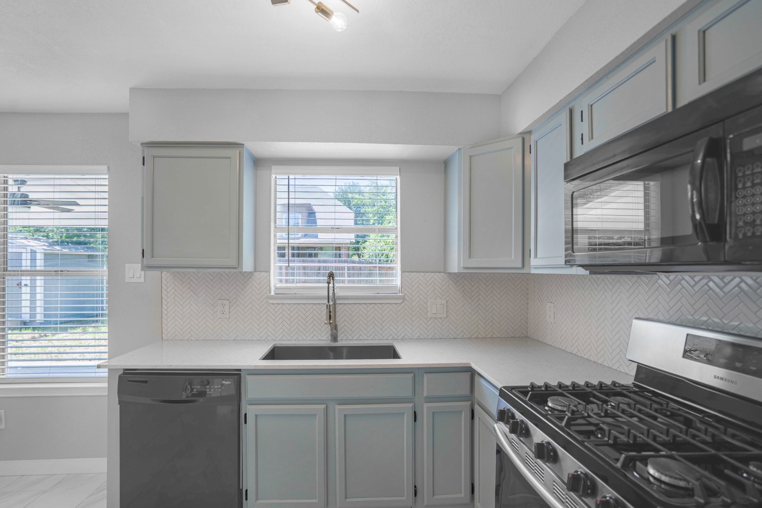 800 Smoke Signal Pass Pflugerville, TX 78660 - Photo 40 of 40 A well-appointed kitchen features ample counter space, a gas range, and a sleek microwave.