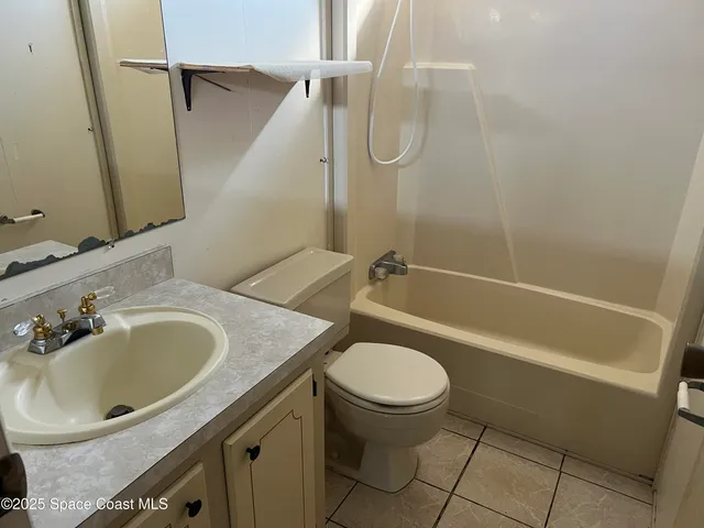 a bathroom with a sink a toilet and a bathtub