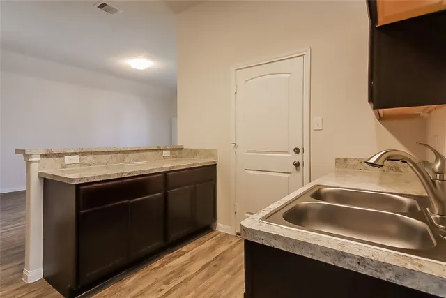 a utility room with a sink washer and dryer