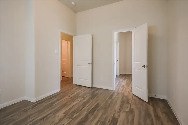 a view of wooden floor in an empty room