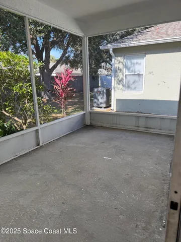 a view of a room with a large window