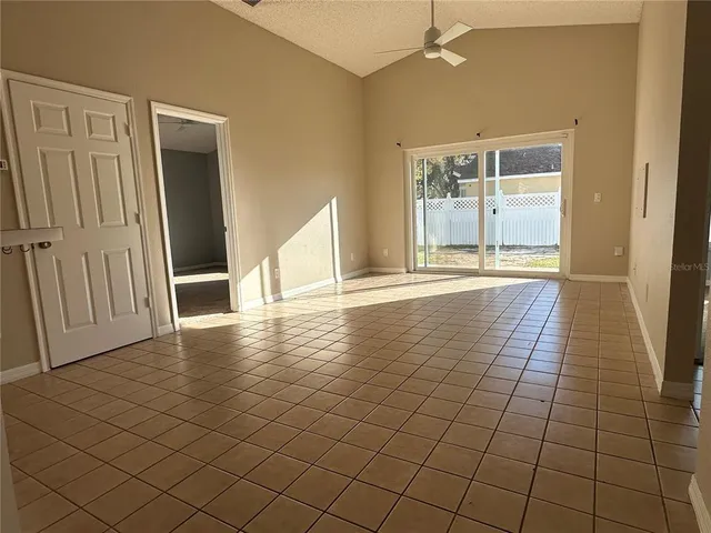 a bathroom with a tub a sink and mirror