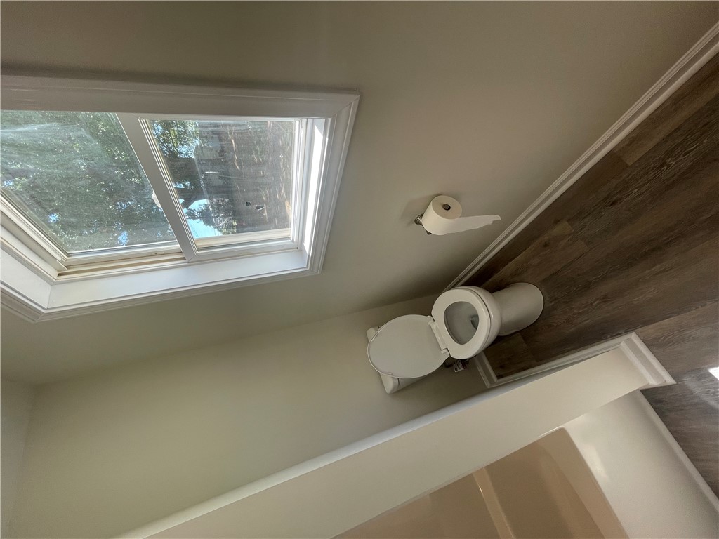 22 3rd Street Pendleton, SC 29670 - Photo 14 of 29 This bathroom features a skylight, providing abundant natural light and enhancing the room's airy feel.