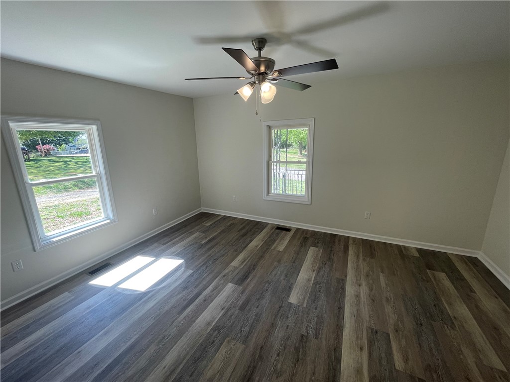 22 3rd Street Pendleton, SC 29670 - Photo 20 of 29 This airy room features durable flooring and ample natural light, perfect for any lifestyle.