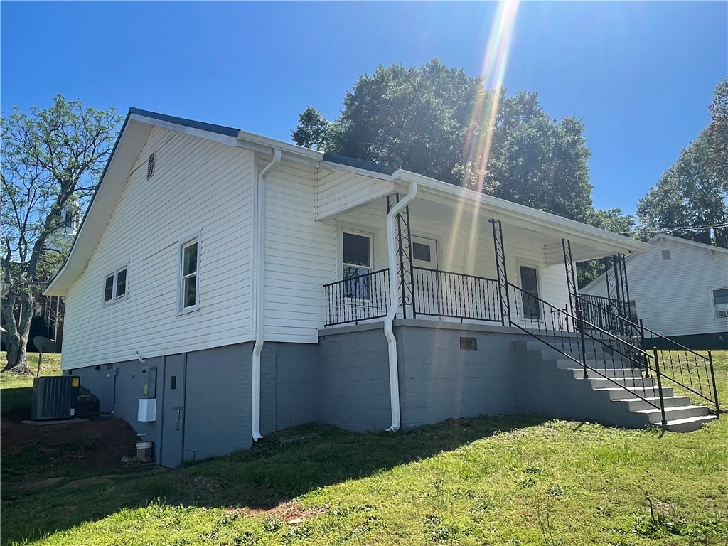 22 3rd Street Pendleton, SC 29670 - Photo 2 of 29 This inviting residence features a welcoming porch, perfect for outdoor enjoyment.