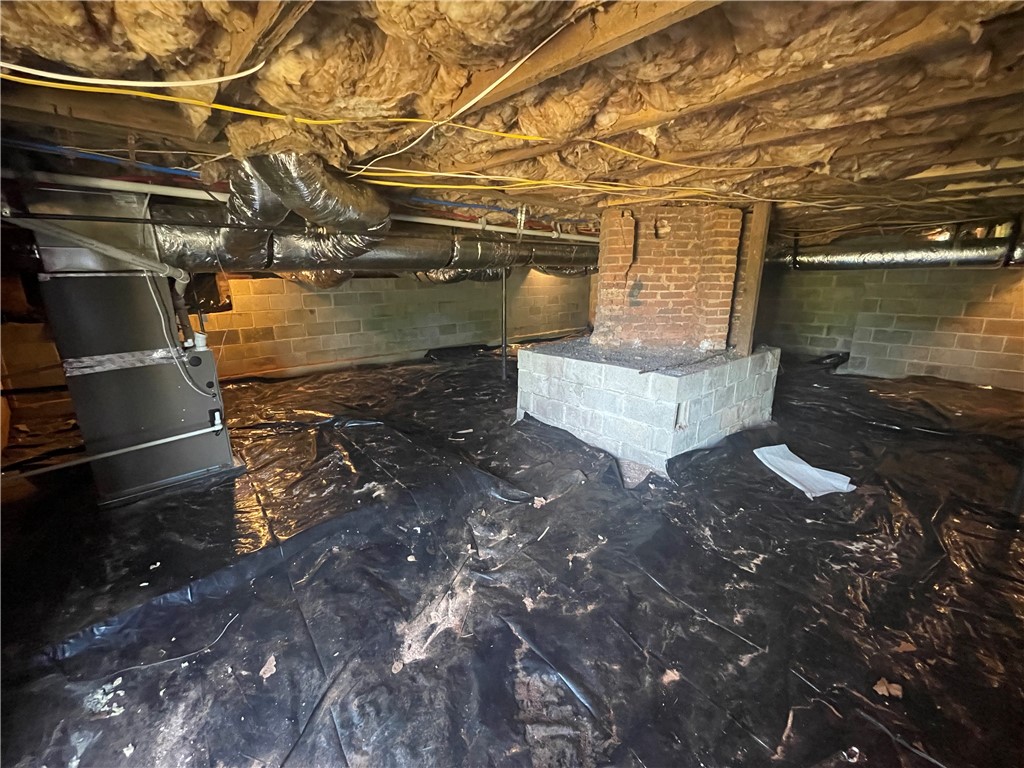 22 3rd Street Pendleton, SC 29670 - Photo 25 of 29 This spacious crawl space offers functional utility and robust structural elements.