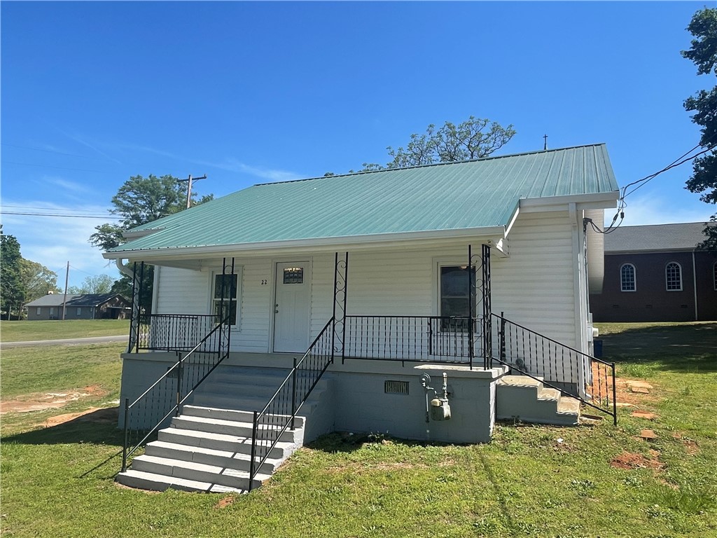 22 3rd Street Pendleton, SC 29670 - Photo 27 of 29 This charming home features a lovely front porch, perfect for enjoying sunny afternoons.