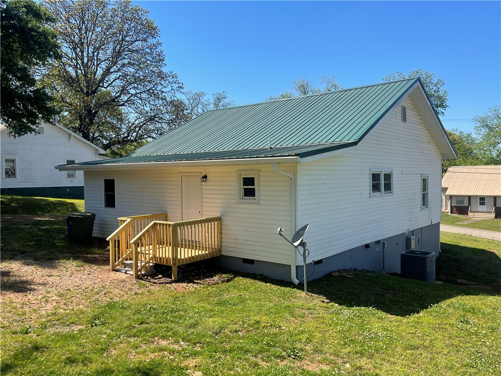 22 3rd Street Pendleton, SC 29670 - Photo 28 of 29 This charming home features a new back deck, ideal for outdoor enjoyment and easy access.