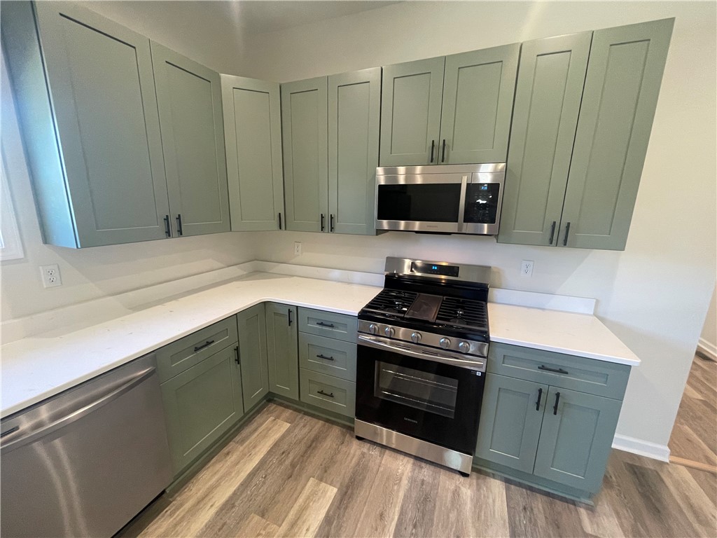 22 3rd Street Pendleton, SC 29670 - Photo 5 of 29 This modern kitchen features sleek appliances and ample counter space for all your culinary endeavors.