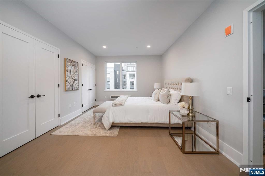 7101 River Road, Unit 304A North Bergen, NJ 07047 - Photo 16 of 24 a bed room with a bed and a couch
