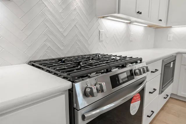 a kitchen with refrigerator and sink