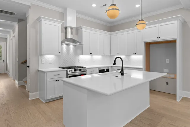 a view of a sink and a chandelier