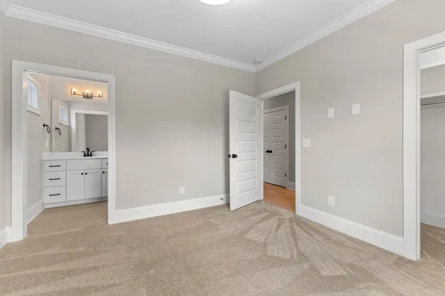 a bathroom with a double vanity sink a mirror and a shower