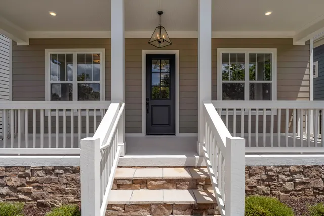 a view of a house with deck front door