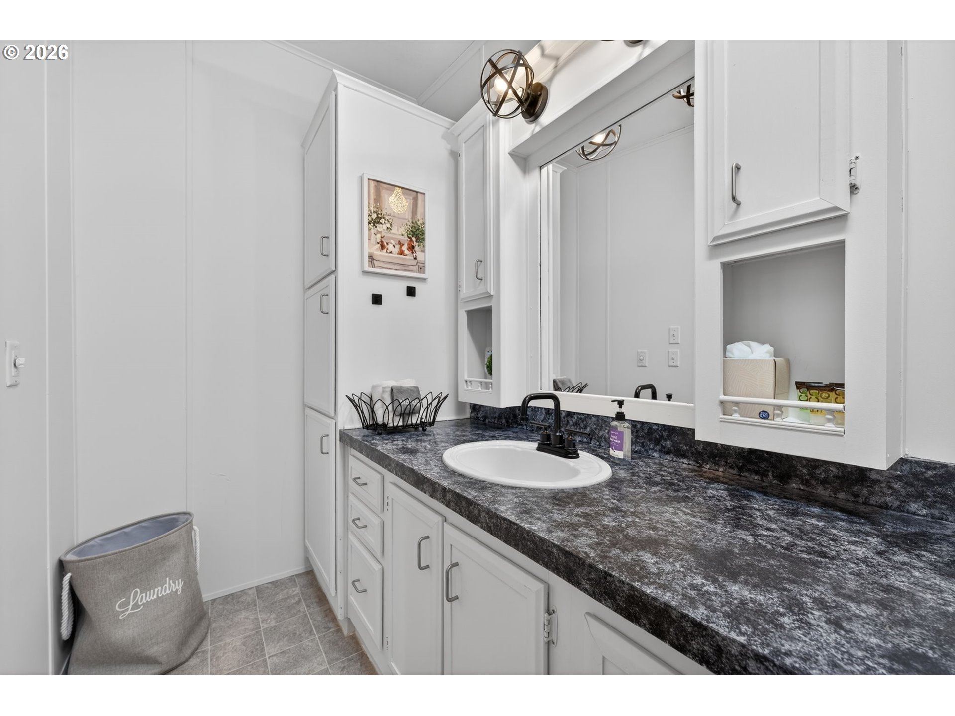 26548 County Road 74G John Day, OR 97845 - Photo 18 of 44 a bathroom with a granite countertop sink and a mirror