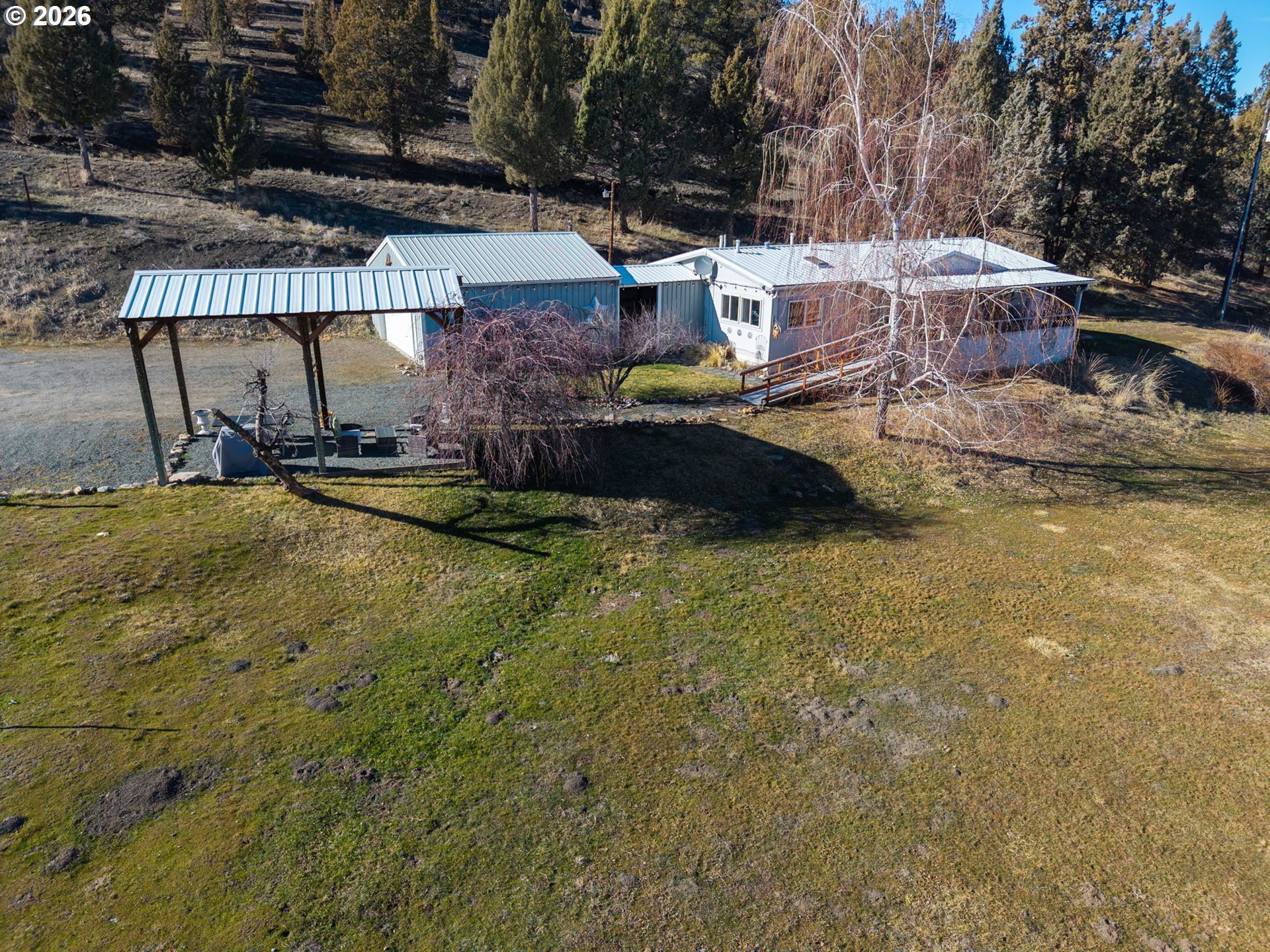 26548 County Road 74G John Day, OR 97845 - Photo 44 of 44 a view of a swimming pool with a patio and a yard