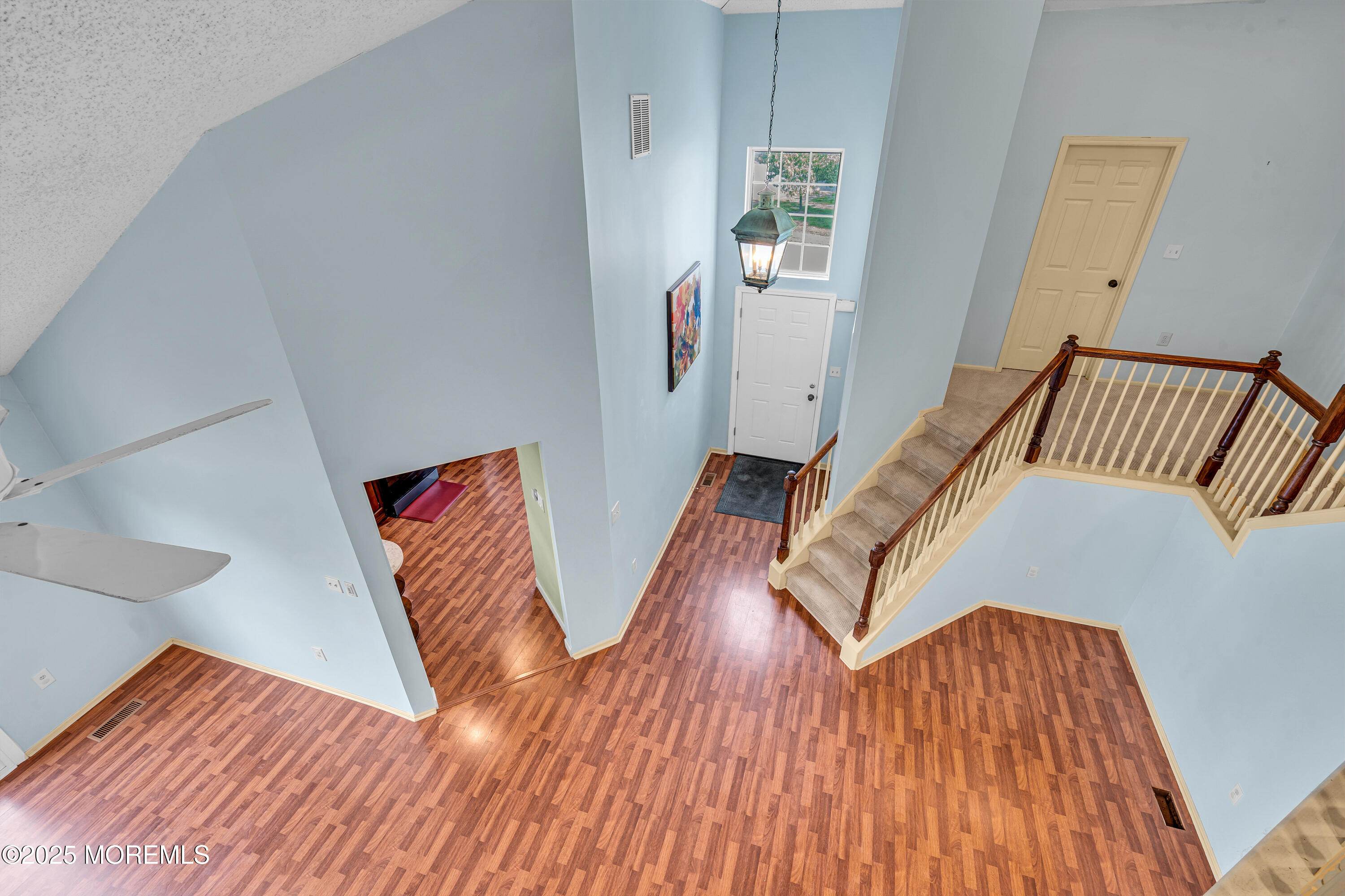57 Racquet Road Wall, NJ 07719 - Photo 25 of 33 a view of wooden floor and windows in a room