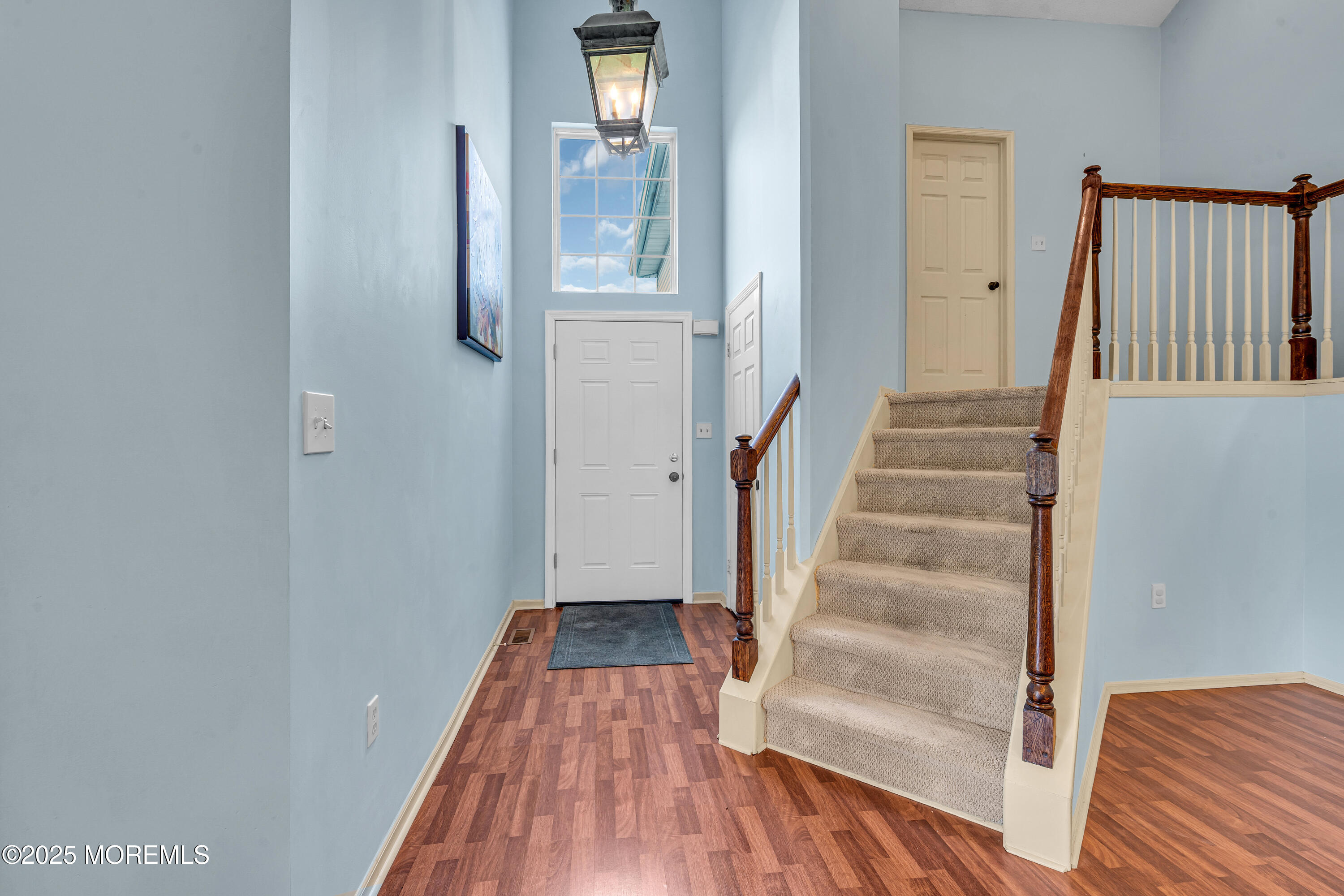 57 Racquet Road Wall, NJ 07719 - Photo 5 of 33 a view of a hallway with wooden floor and entryway