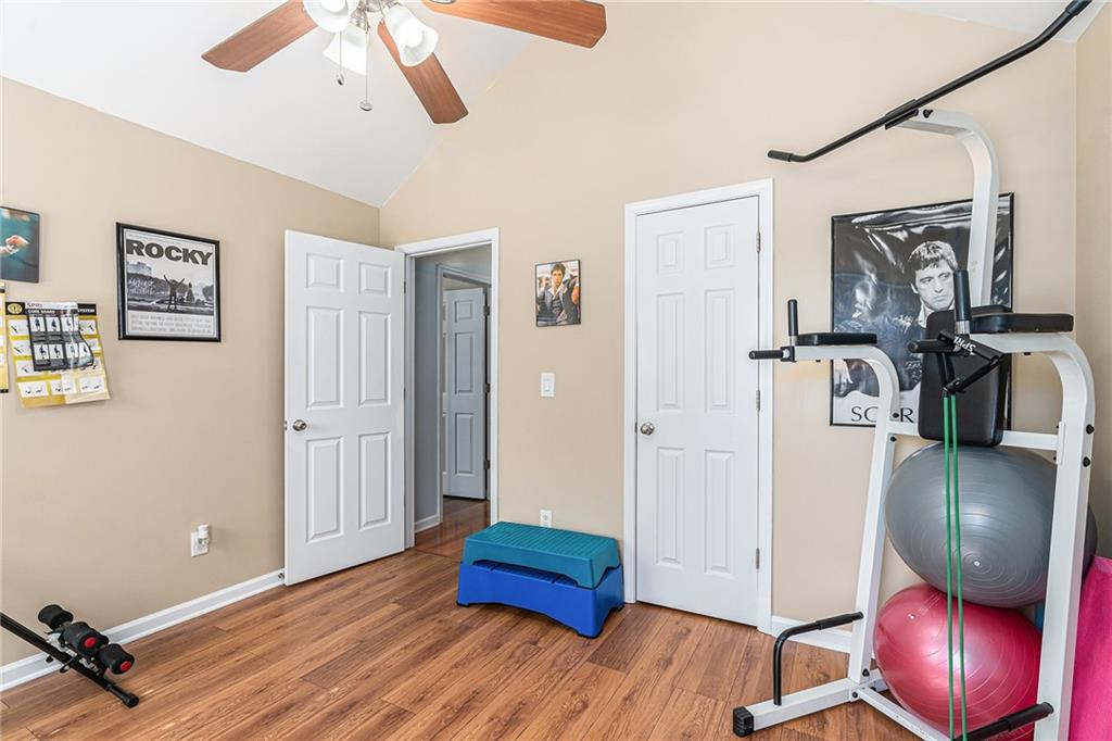 1111 Watercourse Way Hampton, GA 30228 - Photo 27 of 30 a view of a livingroom with wooden floor and furniture