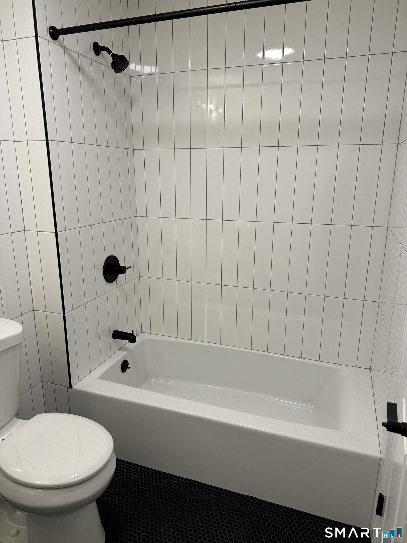 67 Balance Rock Road, Unit 7 Seymour, CT 06483 - Photo 7 of 12 a bathroom with a toilet and a bathtub