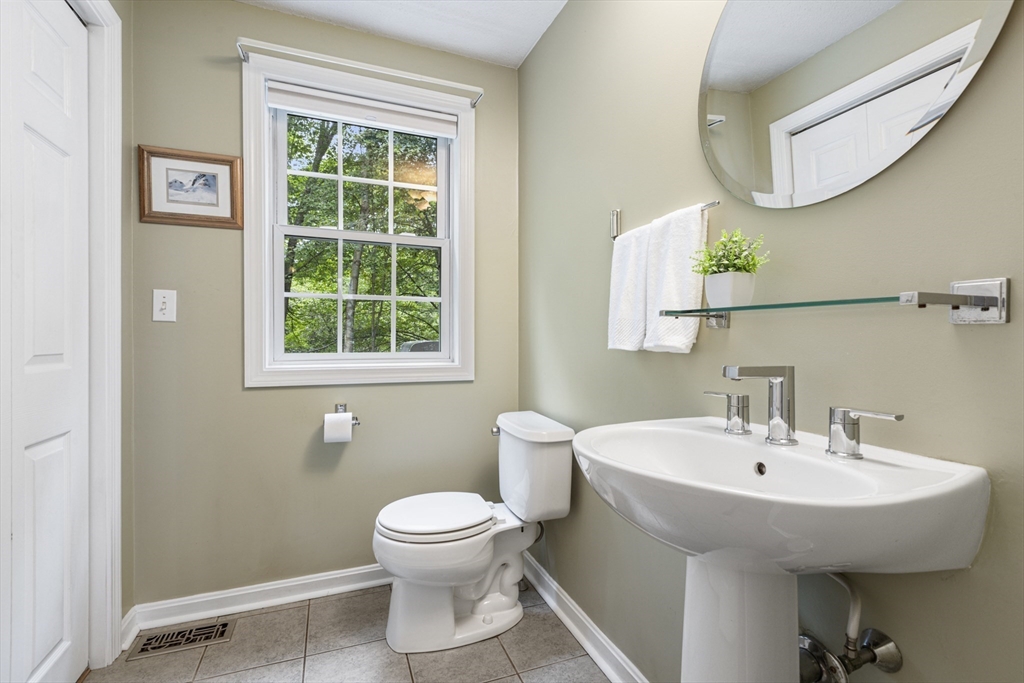 2 Gerald Avenue Millis, MA 02054 - Photo 20 of 38 a bathroom with a sink and a mirror
