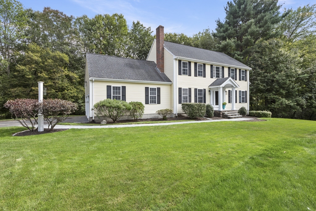 2 Gerald Avenue Millis, MA 02054 - Photo 2 of 38 a front view of a house with a garden