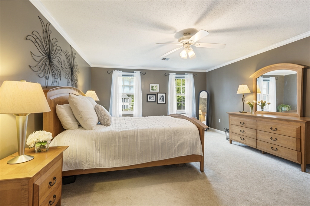 2 Gerald Avenue Millis, MA 02054 - Photo 24 of 38 a bedroom with a bed and a chandelier