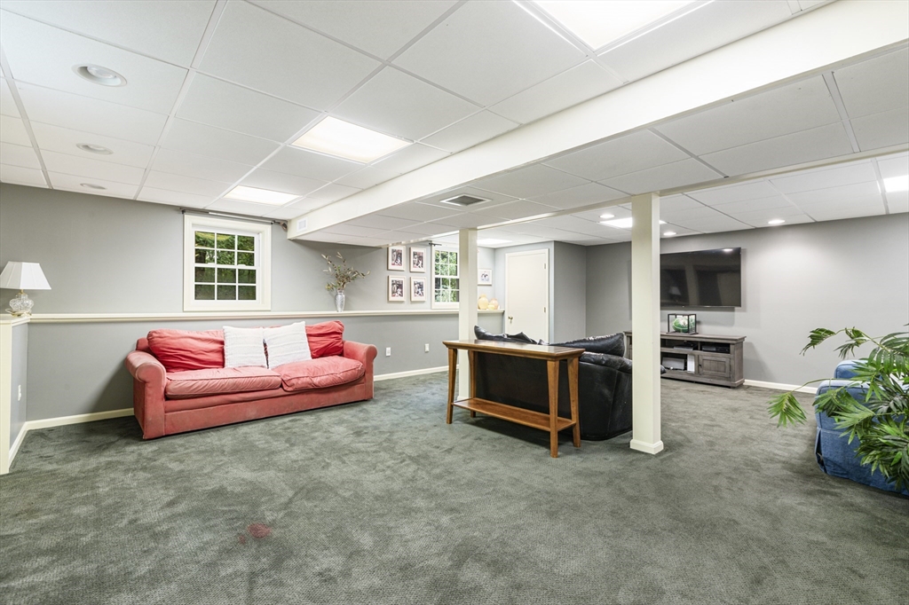 2 Gerald Avenue Millis, MA 02054 - Photo 33 of 38 a living room with furniture and a flat screen tv