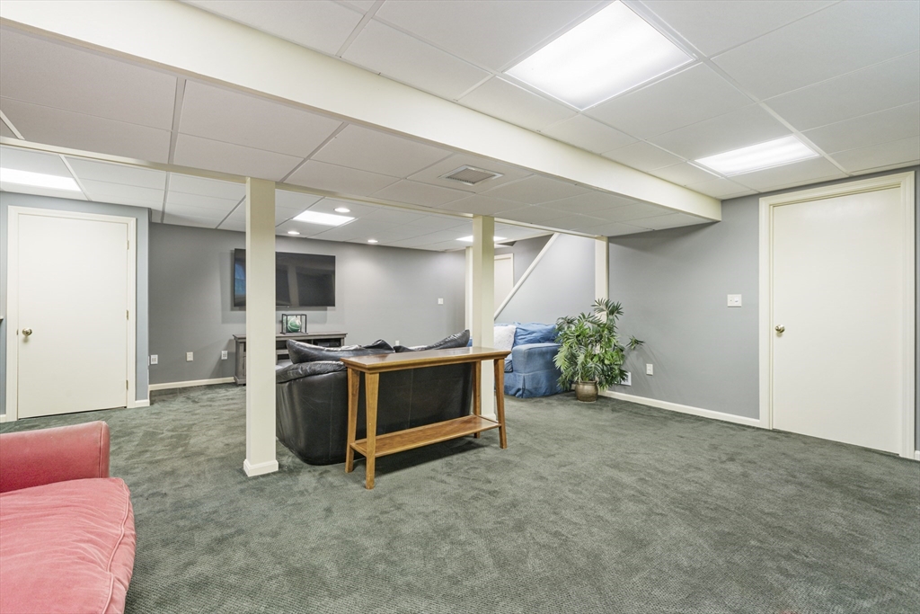 2 Gerald Avenue Millis, MA 02054 - Photo 34 of 38 a view of a livingroom with furniture and a ceiling fan