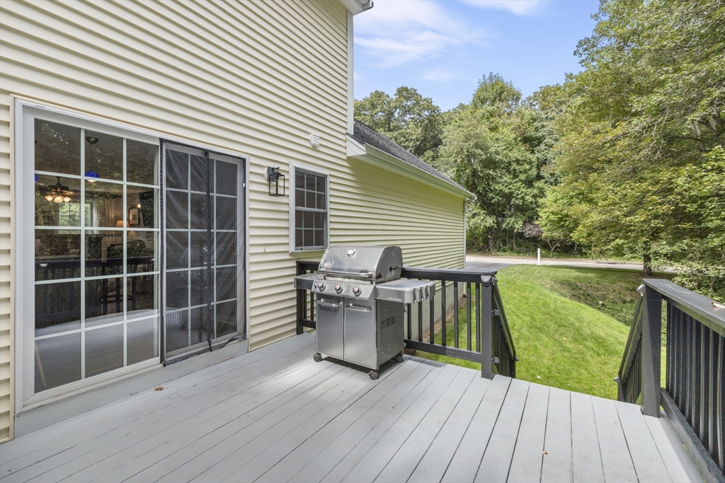 2 Gerald Avenue Millis, MA 02054 - Photo 35 of 38 a view of a deck with couches wooden floor and fence