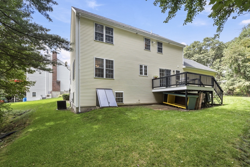 2 Gerald Avenue Millis, MA 02054 - Photo 36 of 38 a view of a house with a yard and sitting area