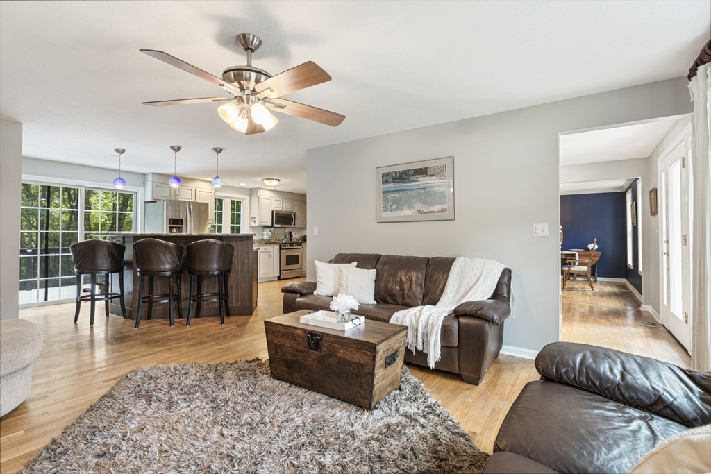 2 Gerald Avenue Millis, MA 02054 - Photo 6 of 38 a living room with furniture and a dining table with wooden floor