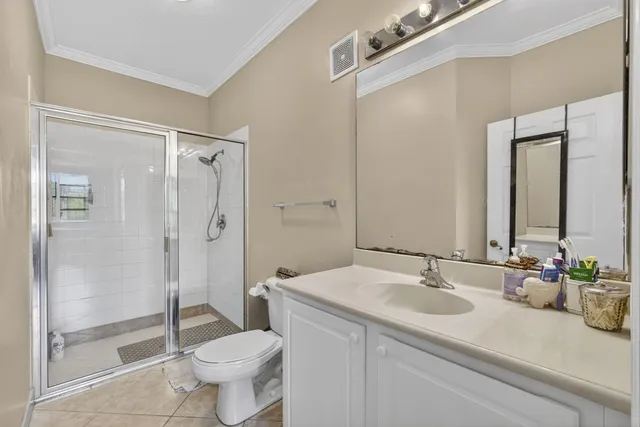 a bathroom with a toilet sink and shower